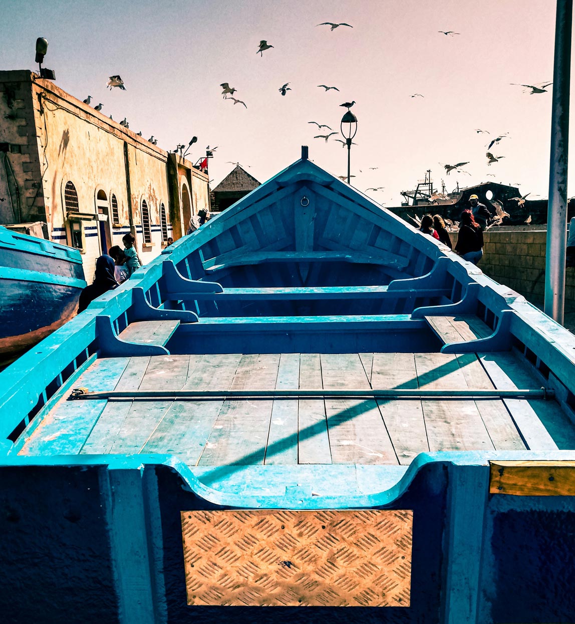 blue boat in the harbour in essaouira