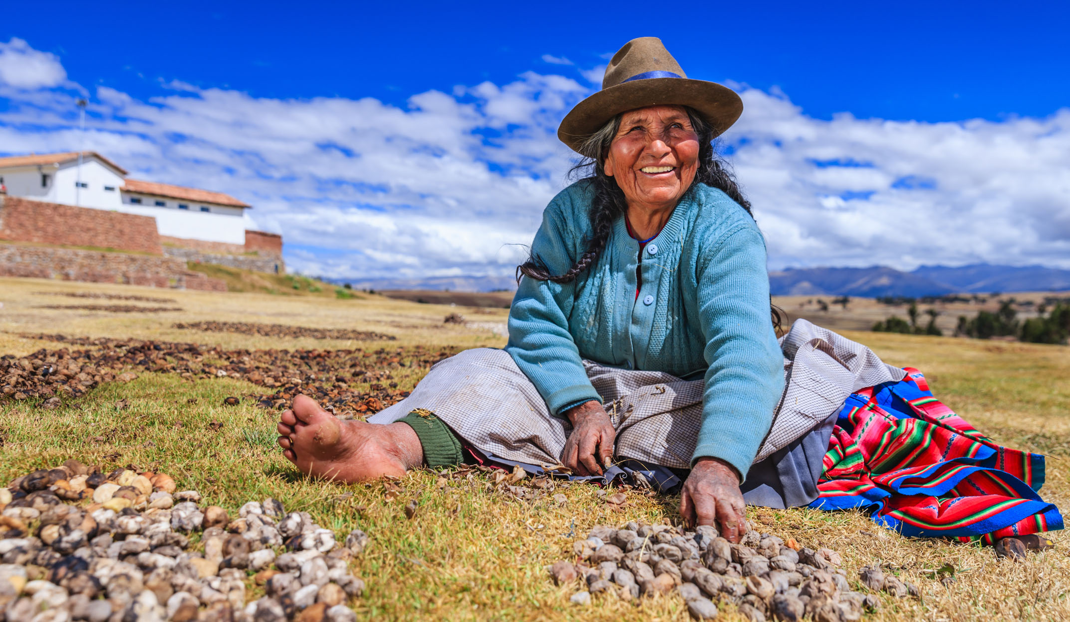 Cuzco woman preparing chuno in peru
