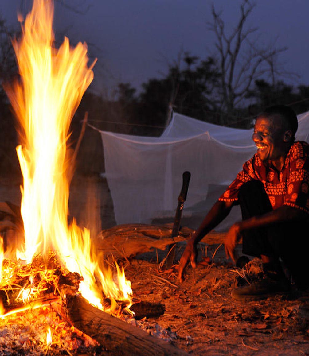 fly camp under the starts in south luangwa with a campfire lit