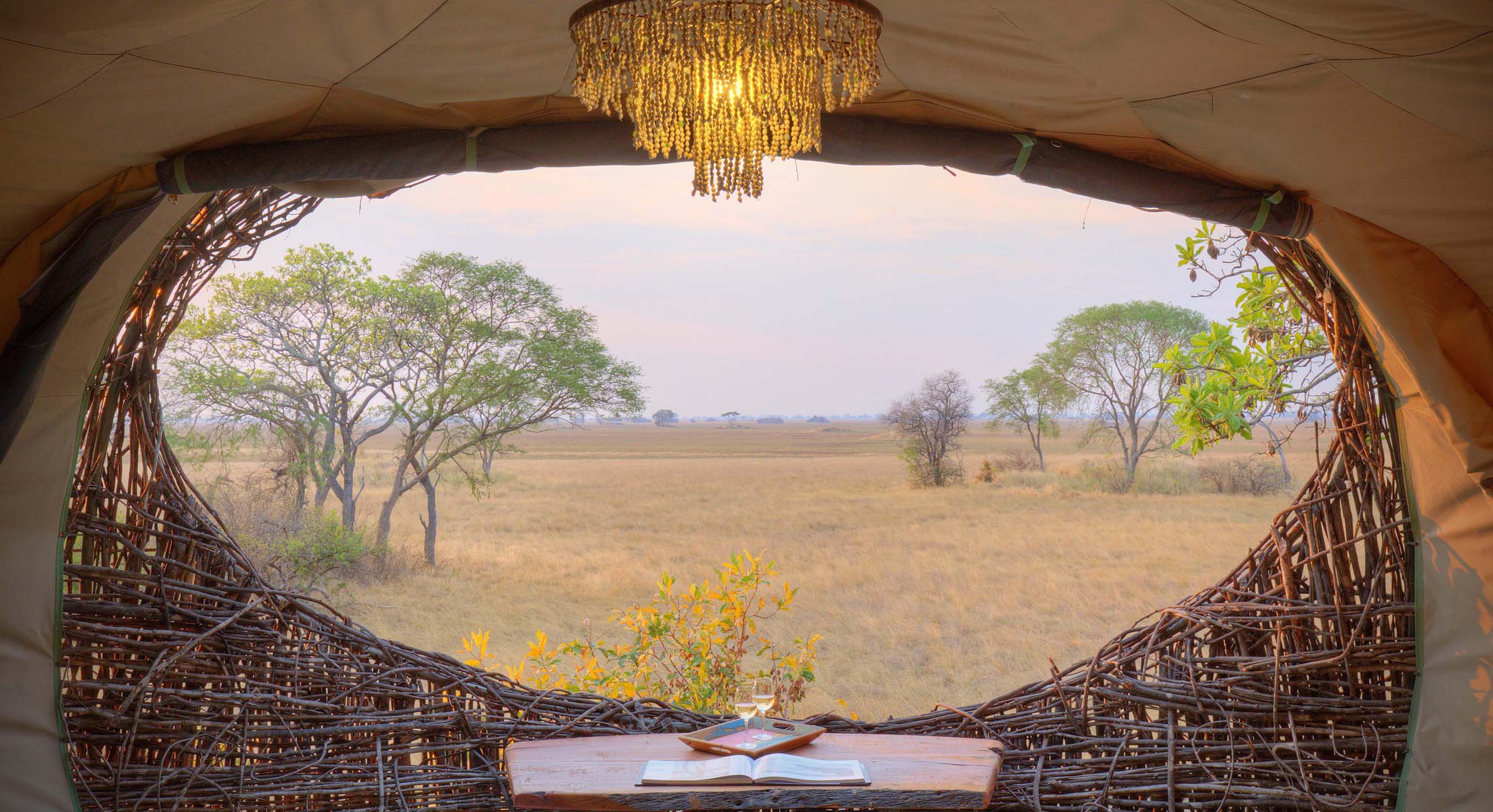 view from the inside of a nest suite at chisa busanga camp in zambia