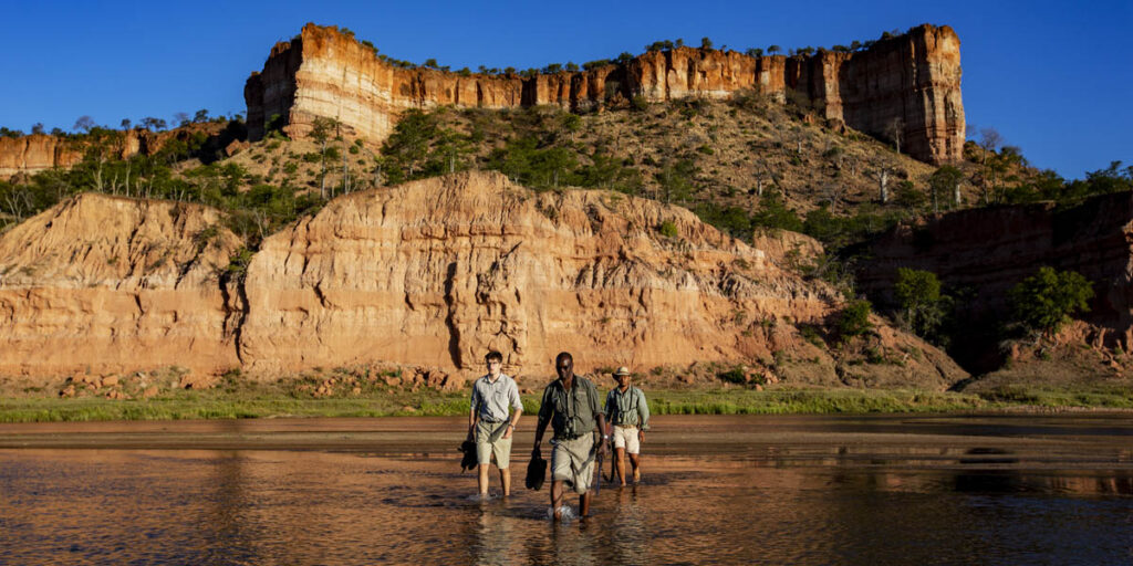 zimbabwe walking safari, tourists moving through the chilo gorge with private expert guide