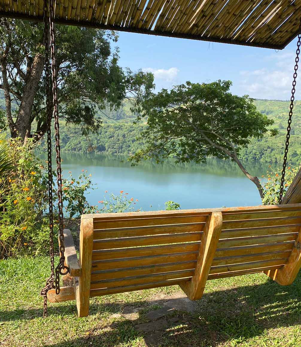 swing bench overlooking the lake at ndali lodge