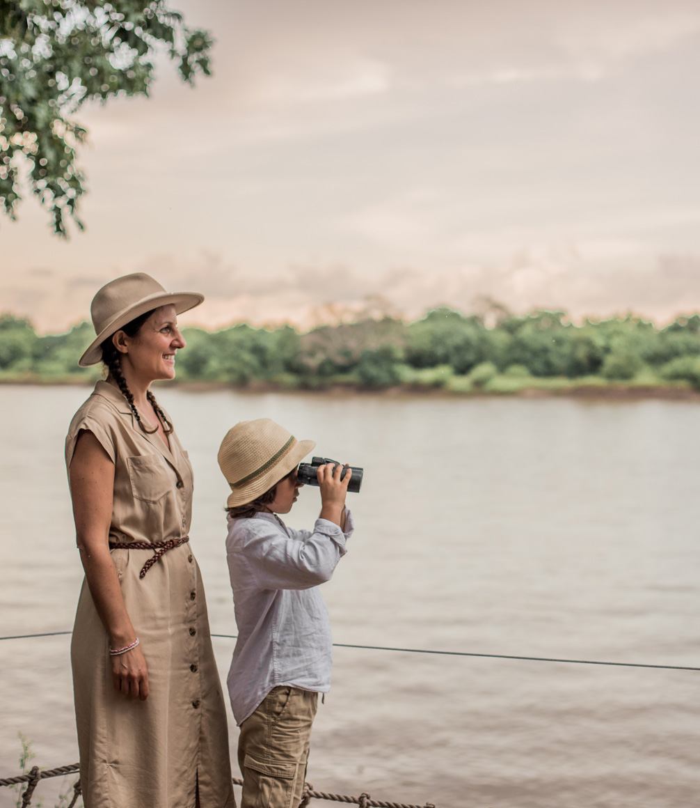 mother and child looking over the river at robin's house