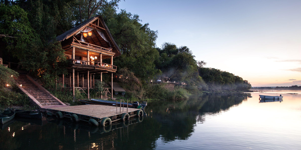 exterior of tongabezi lodge on the riverside