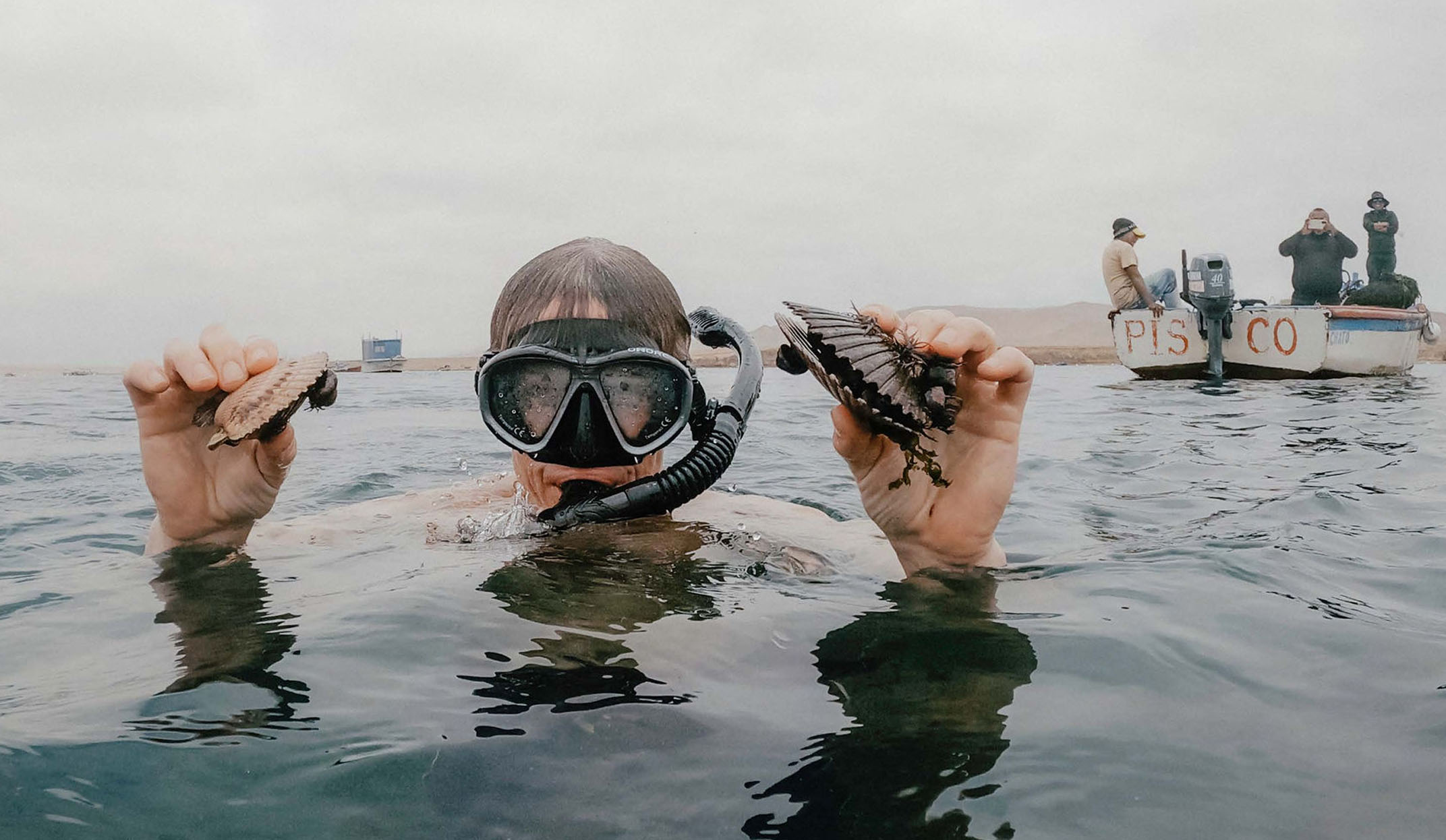 diving for oysters in the paracas region of peru
