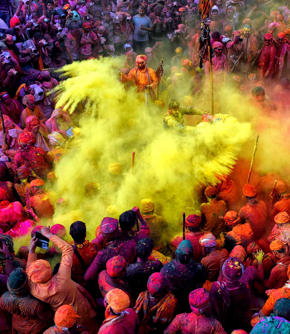 holi festival being celebrated in india with colourful powders throwing