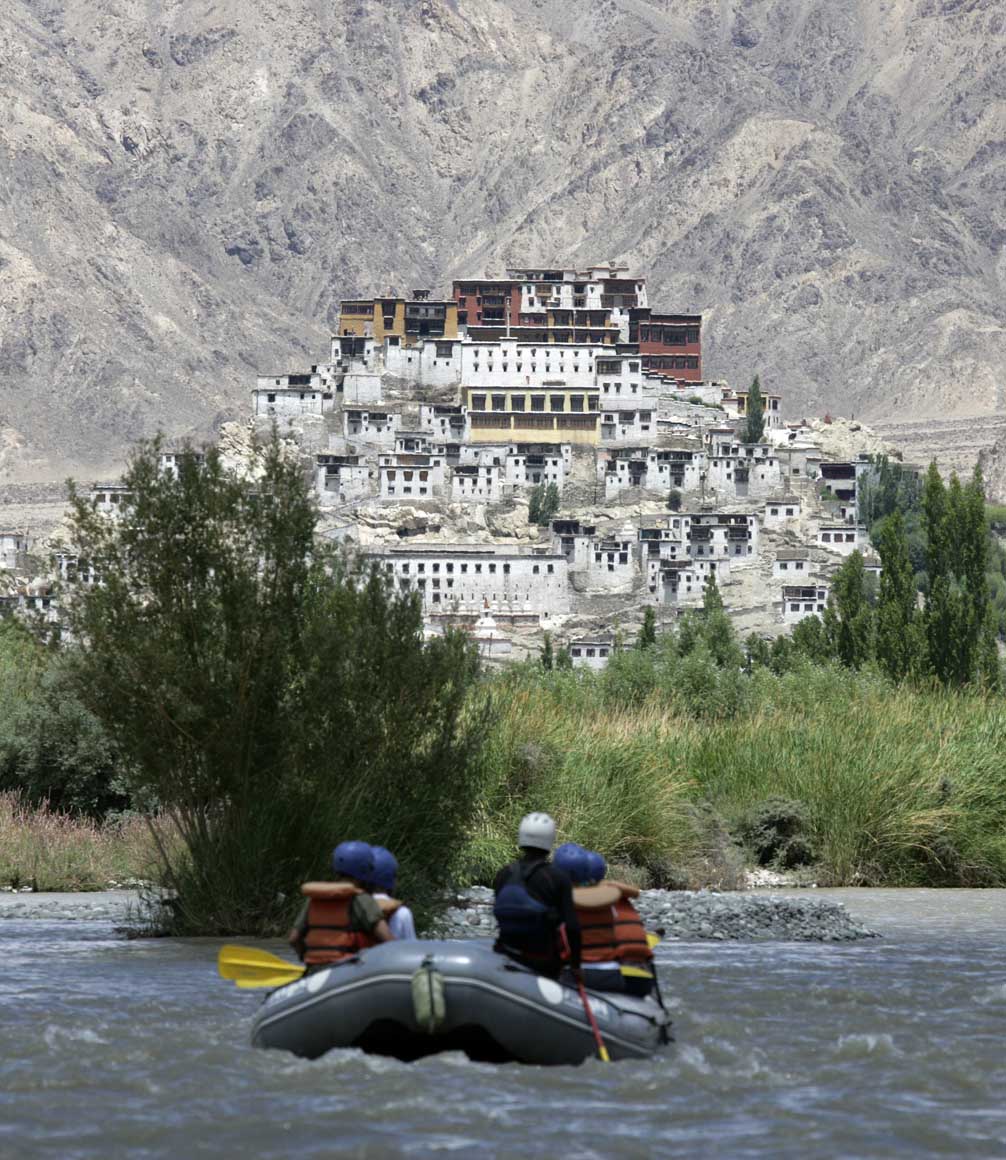rafting on the river indus in ladakh in front of thiskey monastery
