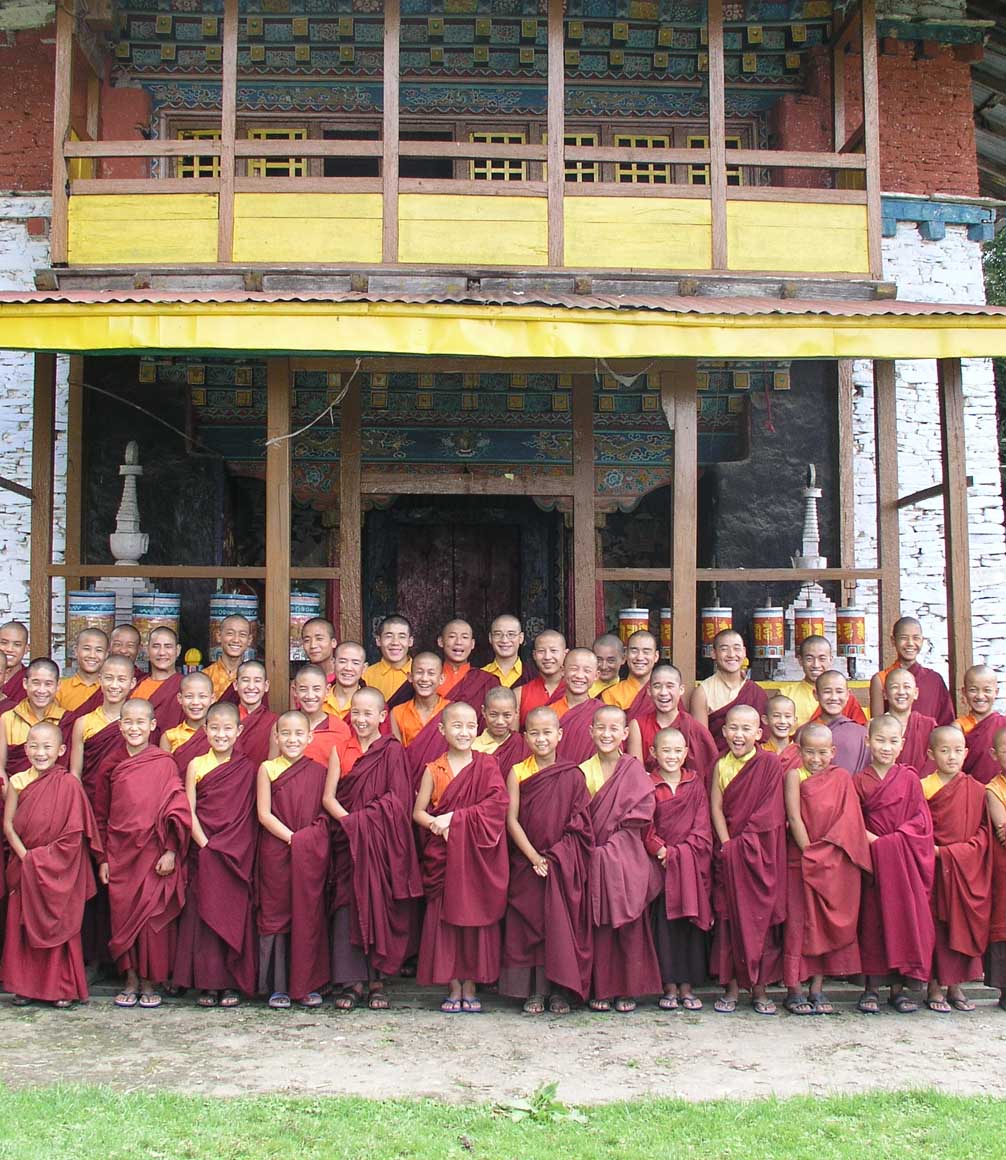 children trainee monks outside house in sikkim in northern india