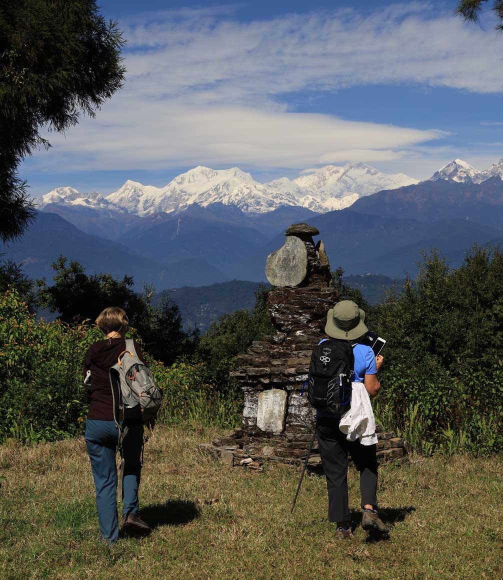 couple walking through sikkim in sight of the himalayan peaks