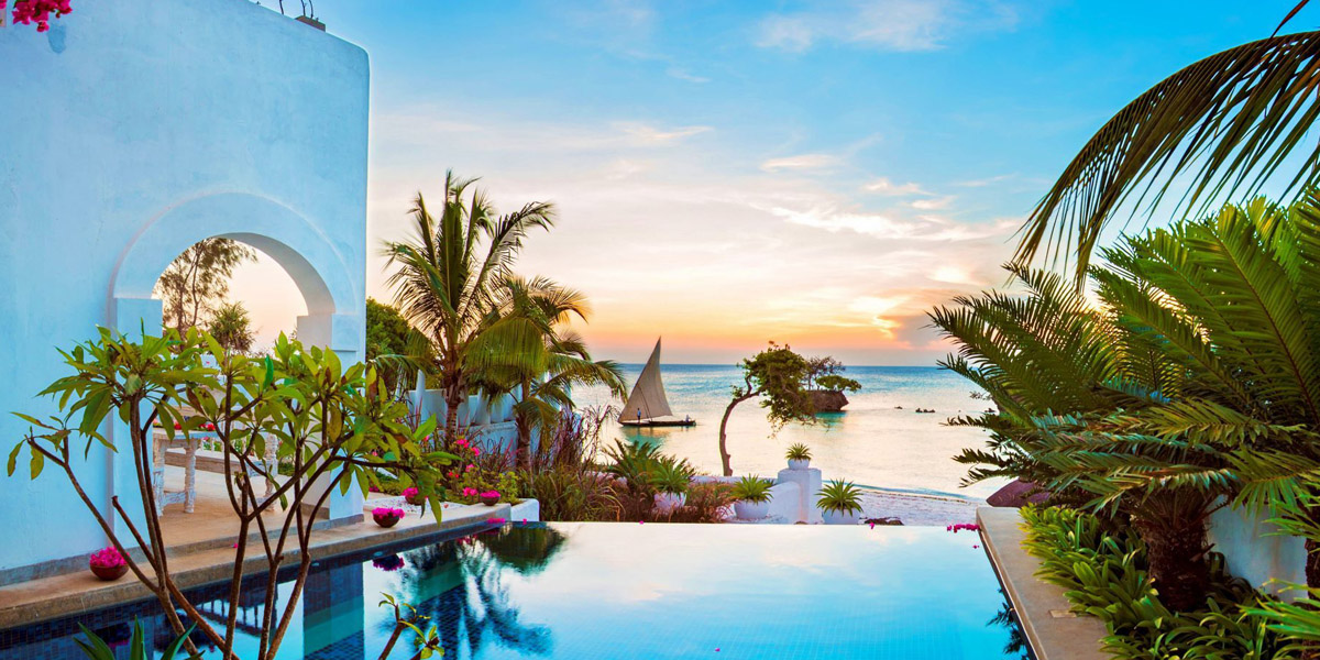 view from the royal villa pool over the beach to the ocean at aiyana resort pemba island