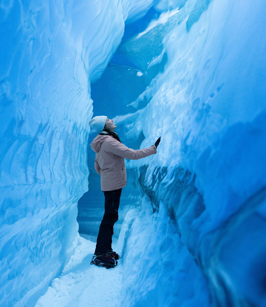guest walking through ice tunnels from white desert camp in antarctica