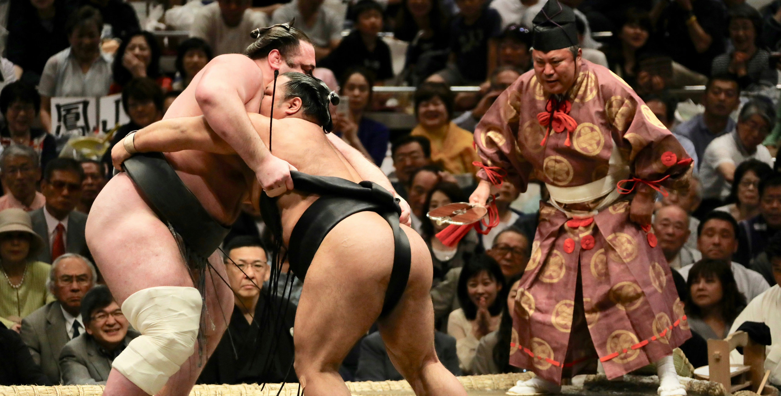 sumo wrestlers in the ring at the tournament in tokyo