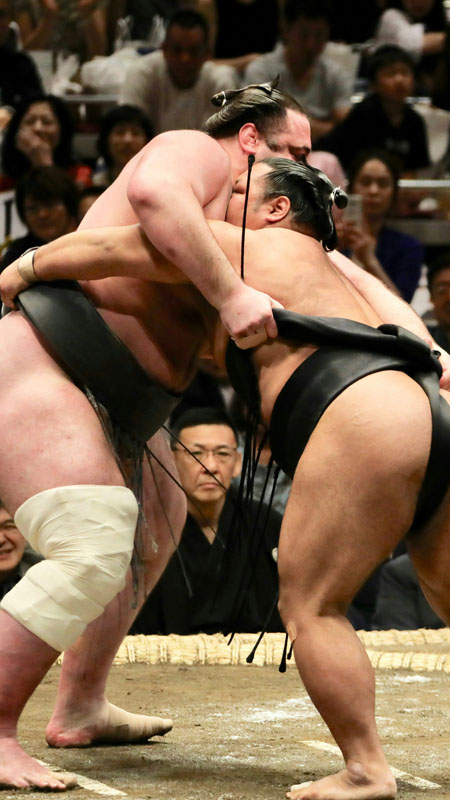 sumo wrestlers in the ring at the tournament in tokyo