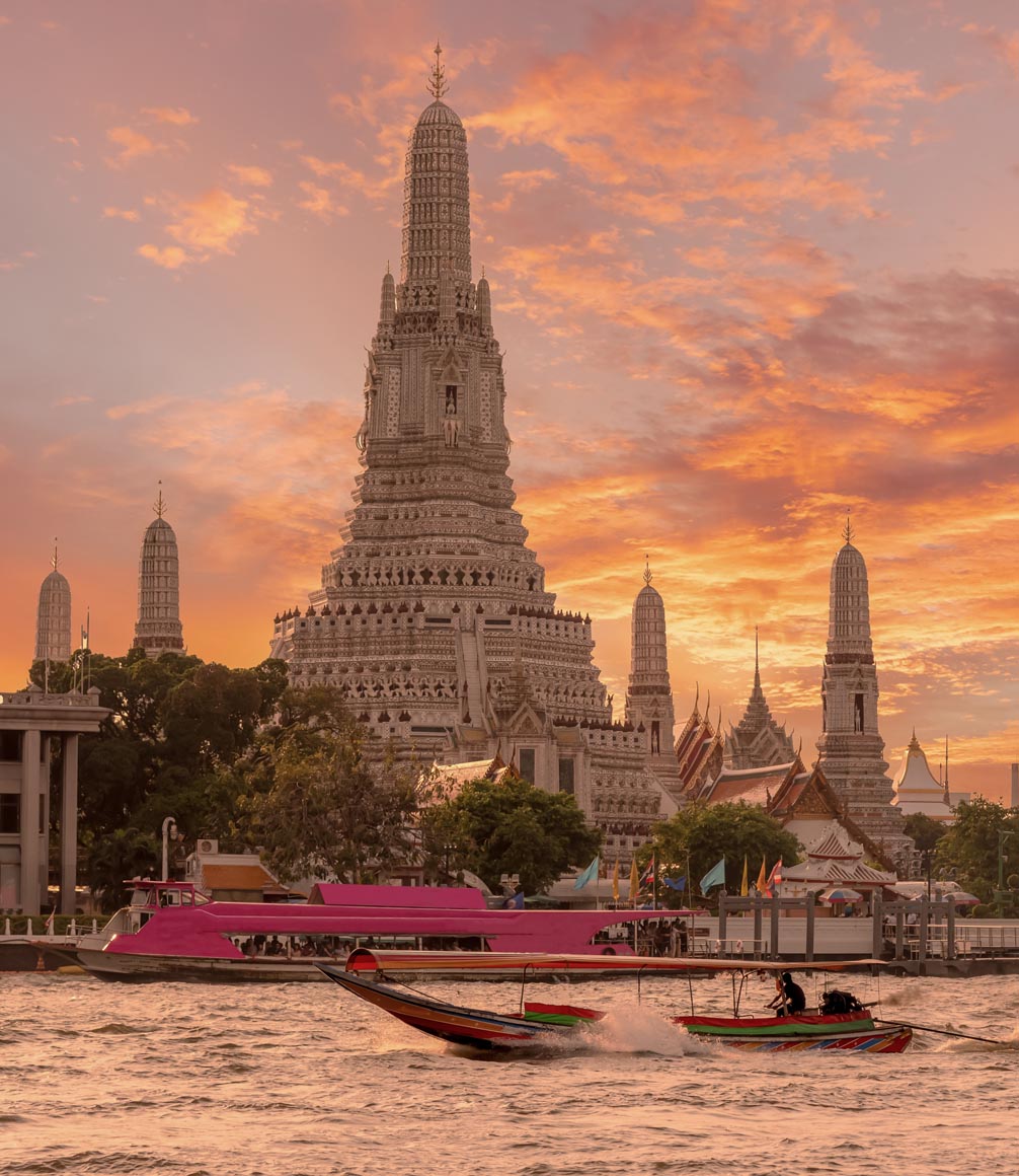 view of wat arun from river in bangkok