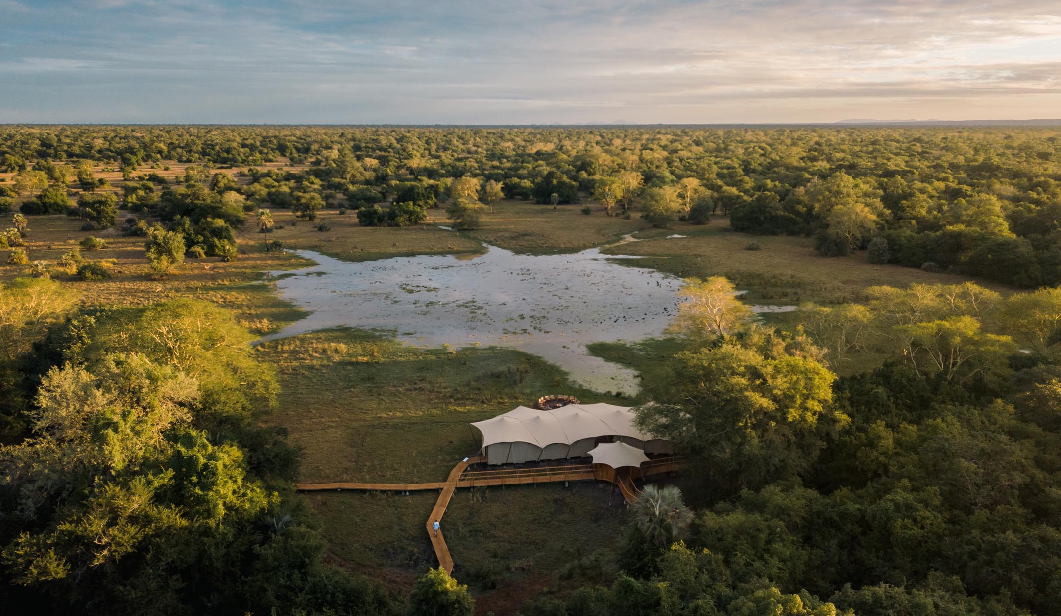 aerial view of chicari camp and wateringhole in gorongosa, mozambique