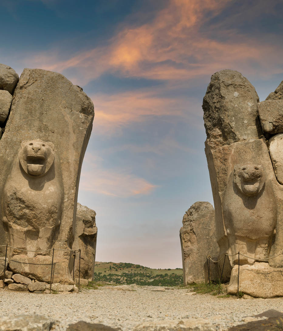 twin lion statues flank the walkway at the lion gate in Hattusa, the hittite capital, turkey