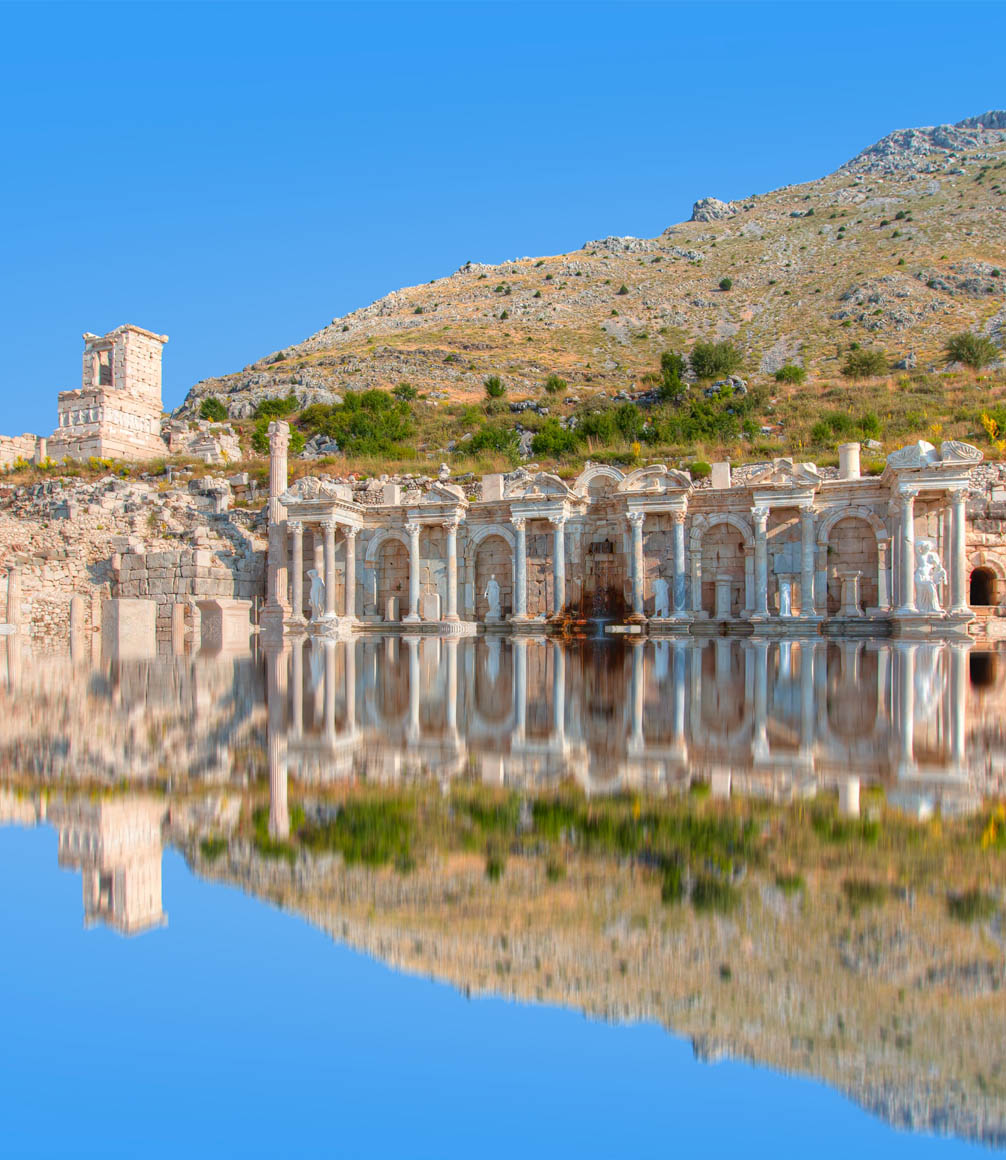 antoninus foundain in sagalassos with reflection in water